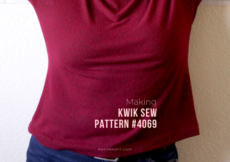 Zoomed in shot of a women's torso in a red sweater with text overlay that reads Making Kwik Sew Pattern #4069, petitefont.com