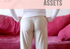 Back view of a woman in loose fit camel suede pants standing with hands on her hips in front of a red couch. Text overlay reads Make New Look #6399. Show off your assets. PetiteFont.com