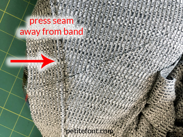 Como Cardigan Sew Along: sleeve band attached to body, arrow pointing away from band