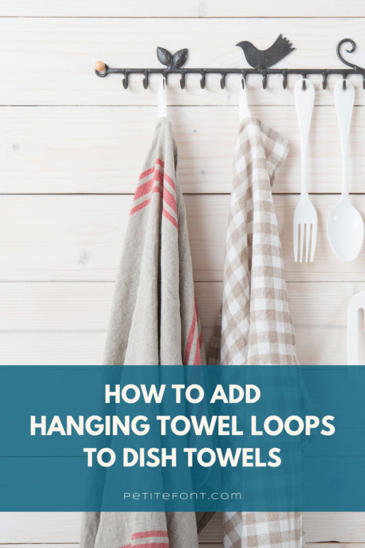 2 dish towels and kitchen supplies hanging from an iron look system on a wood wall. Text overlay reads "how to add hanging towel loops to dish towels"