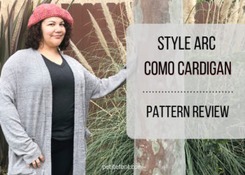 Como cardigan modeled from front on woman with one hand on a tree and text overlay Style Arc Como Cardigan Pattern Review