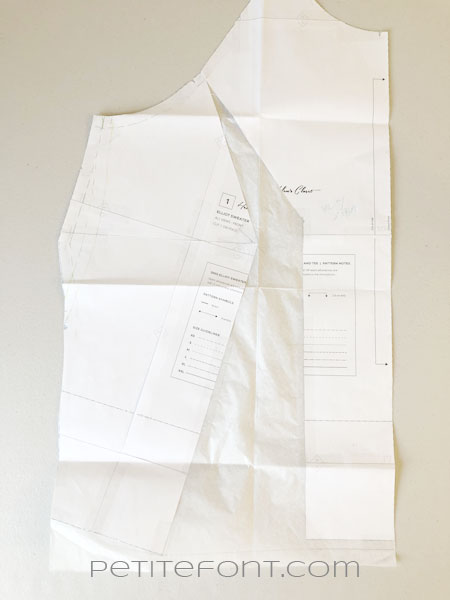 Altered front sewing pattern piece with medical paper inserted in gaps