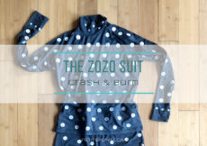 Flat lay of black turtleneck covered in white dots with text overlay that reads The Zozo Suit Crash and Burn petite font dot com