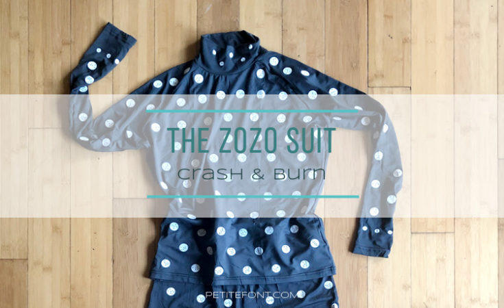 Flat lay of black turtleneck covered in white dots with text overlay that reads The Zozo Suit Crash and Burn petite font dot com