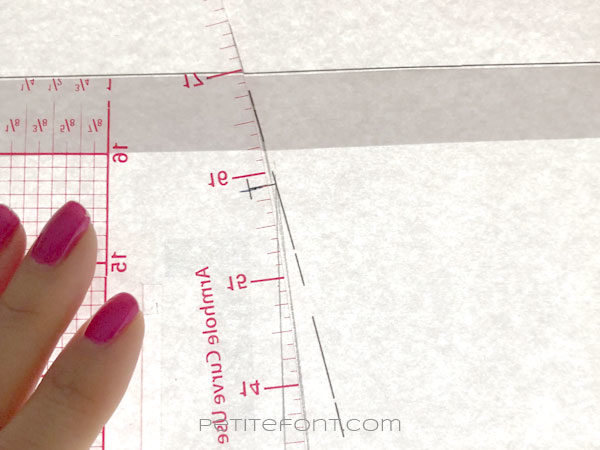 Image of curved ruler along the skirt pattern side seam showing how to smooth the seam