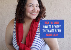Curly haired woman smiling wearing a red scarf over a blue and white knit tank dress. A blue box next to her has text in red and white that reads hack this dress, how to remove the waist seam McCall's 6744. At the bottom of the picture is the site address petite font dot com.