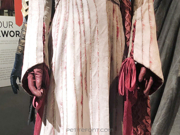 Detail of laced cuffs on Queen Daenerys Targaryen's costume in the Game of Thrones costumes exhibition at FIDM Museum