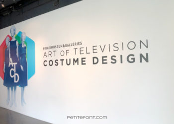 White wall with 3 fashion drawings and large text that reads FIDM Museum & Galleries Art of Television Costume Design