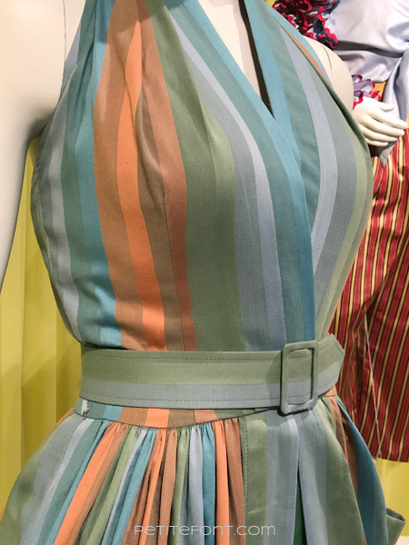 Detail view of the bodice dart on the striped halter dress on a mannequin from the Amazon Prime show The Marvelous Mrs. Maisel, from FIDM 13th Art of Television Costume Design exhibit