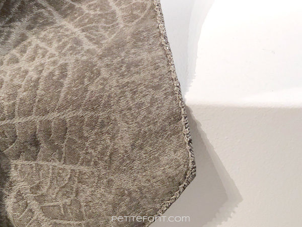 Detail of embroidered edges of Sansa Stark's costume in the Game of Thrones costumes exhibition at FIDM Museum