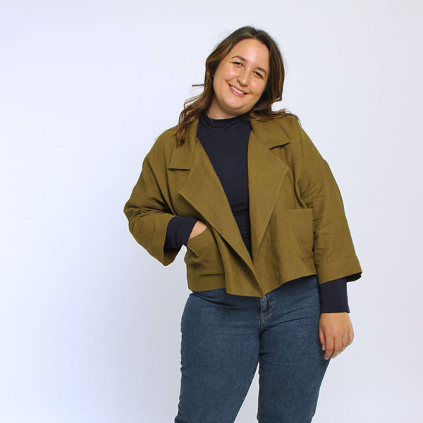 Woman against white background in an olive Helen's Closet Pona Jacket