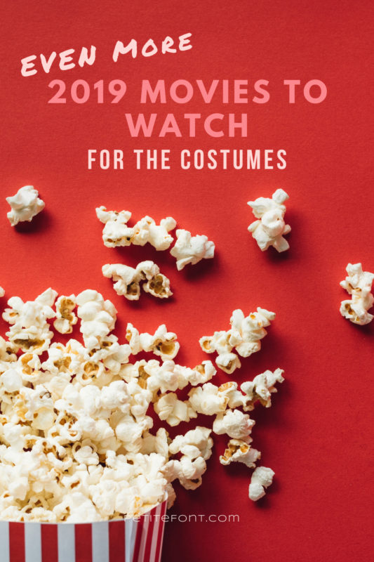 Popcorn box overflowing onto a red background with pink text that reads Even More 2019 Movies to Watch for the Costumes