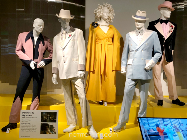 Display of My Name is Dolomite costumes at the 2020 movie costumes exhibit at FIDM