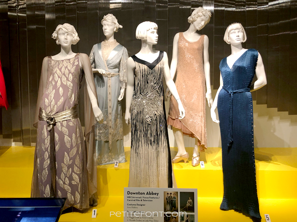Display of Downton Abbey costumes at the 2020 movie costumes exhibit at FIDM