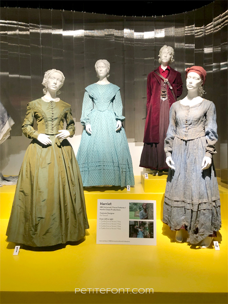 Display of Harriet costumes at the 2020 movie costumes exhibit at FIDM