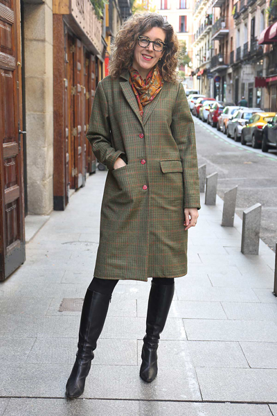 Woman posing on the street in a long tweed coat, modeling the Liesl & Co Chaval coat