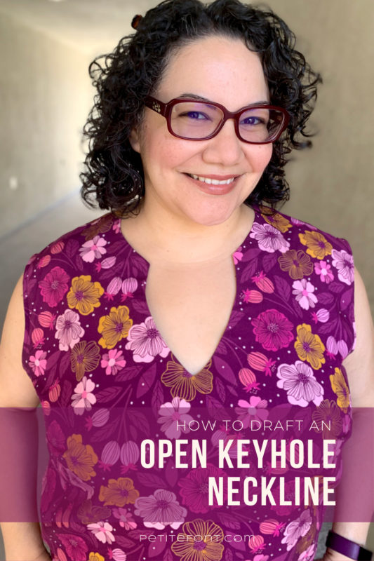Latina woman with black curly hair and red glasses smiling at the camera in a floral open keyhole blouse. Text overlay reads "how to draft an open keyhole neckline, PetiteFont.com"