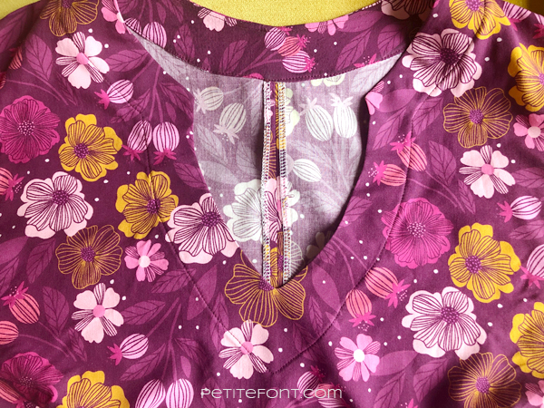 Close up detail of the hacked keyhole neckline topstitching on Figo Sangria fabric