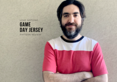 Ryan leaning against a stucco wall with his arms crossed over his chest. Black text overlay reads Love Notions Game Day Jersey Pattern Review