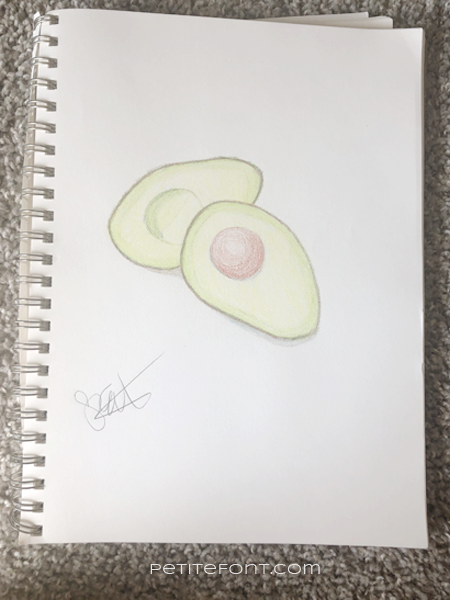 Crayon drawing of an avocado signed by artist