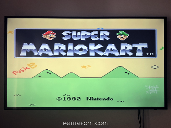 Television with the starting screen of Super MarioKart on.