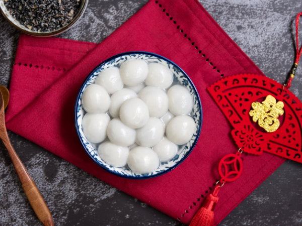 A bowl of tangyuan on a red napkin