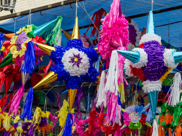 A group of brightly colored star piñatas