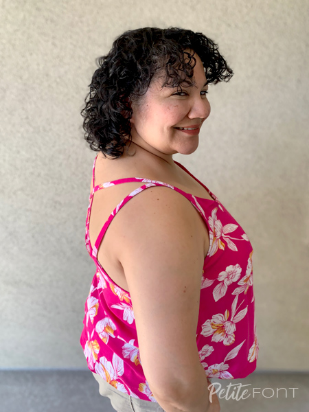 Paulette turned to the right to show the straps of her hot pink hibiscus print Misty cami