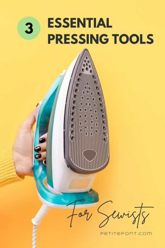 A hand with black nails holds a large bright turquoise iron against a yellow background. Text overlay reads "3 essential pressing tools for sewists"