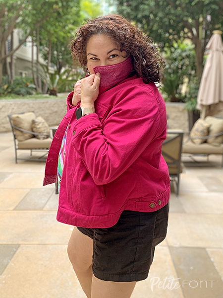 Paulette hides behind the collar of her pink jacket