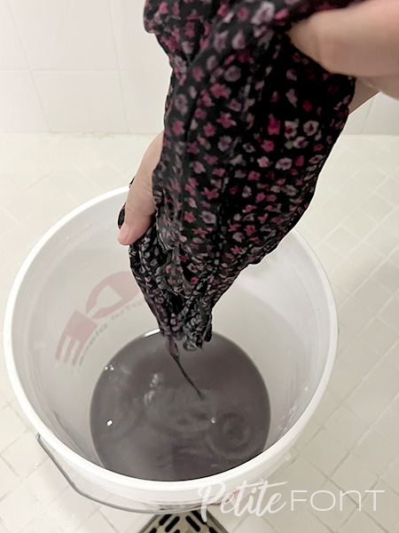 Wringing fabric over a bucket